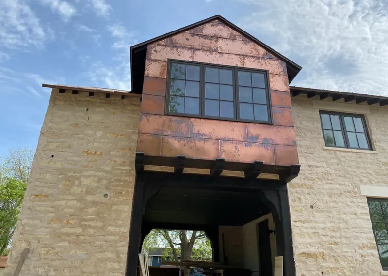 Copper metal panel facade on a stone building for Metal Roof Coating in Boxborough